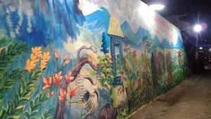 Lukisan mural di tembok RT 02/RW 08 Jalan Danau Toba. (Deny) 