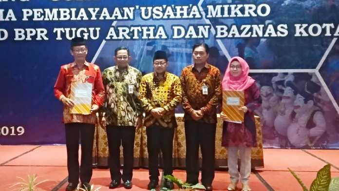 Wali Kota Malang Sutiaji resmi meluncurkan program Ojir BPR Tugu Artha Sejahtera - Baznas Kota Malang di Hotel Savana, Jumat (6/12). (Aziz Ramadani MVoice)